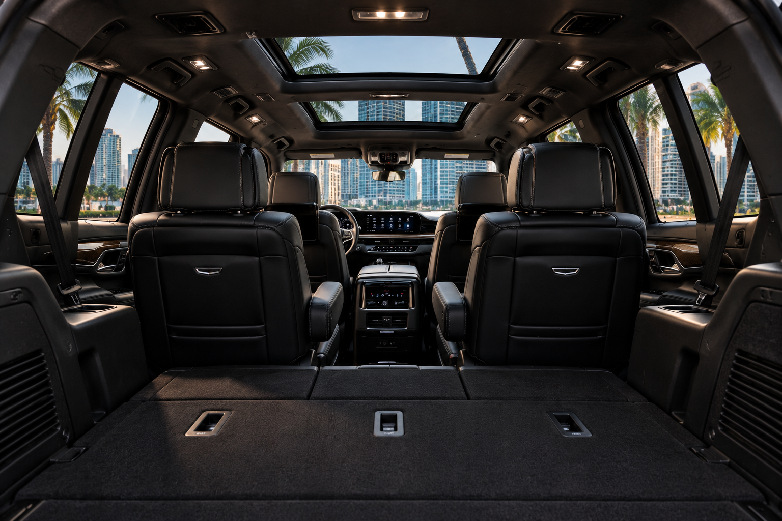 Cadillac Escalade ESV cabin with black leather seating and panoramic sunroof