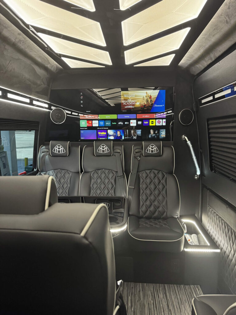 Mercedes-Benz Executive Sprinter interior with leather seats and front TV screen